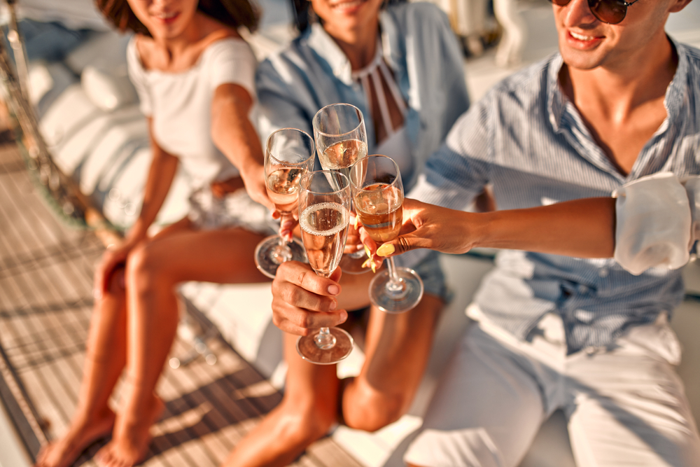 Cheers!,Cropped,Image,Of,Group,Of,Friends,Relaxing,On,Luxury